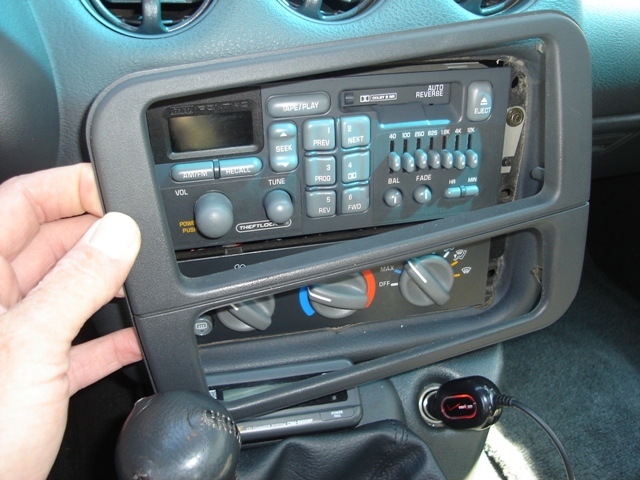 Remove trim around radio