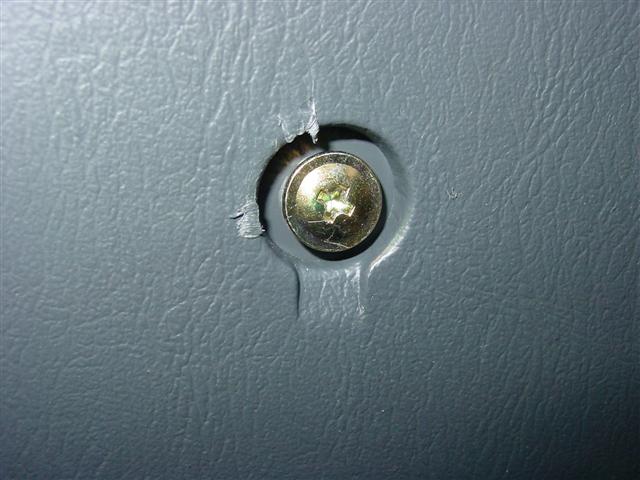Screw covered by trim